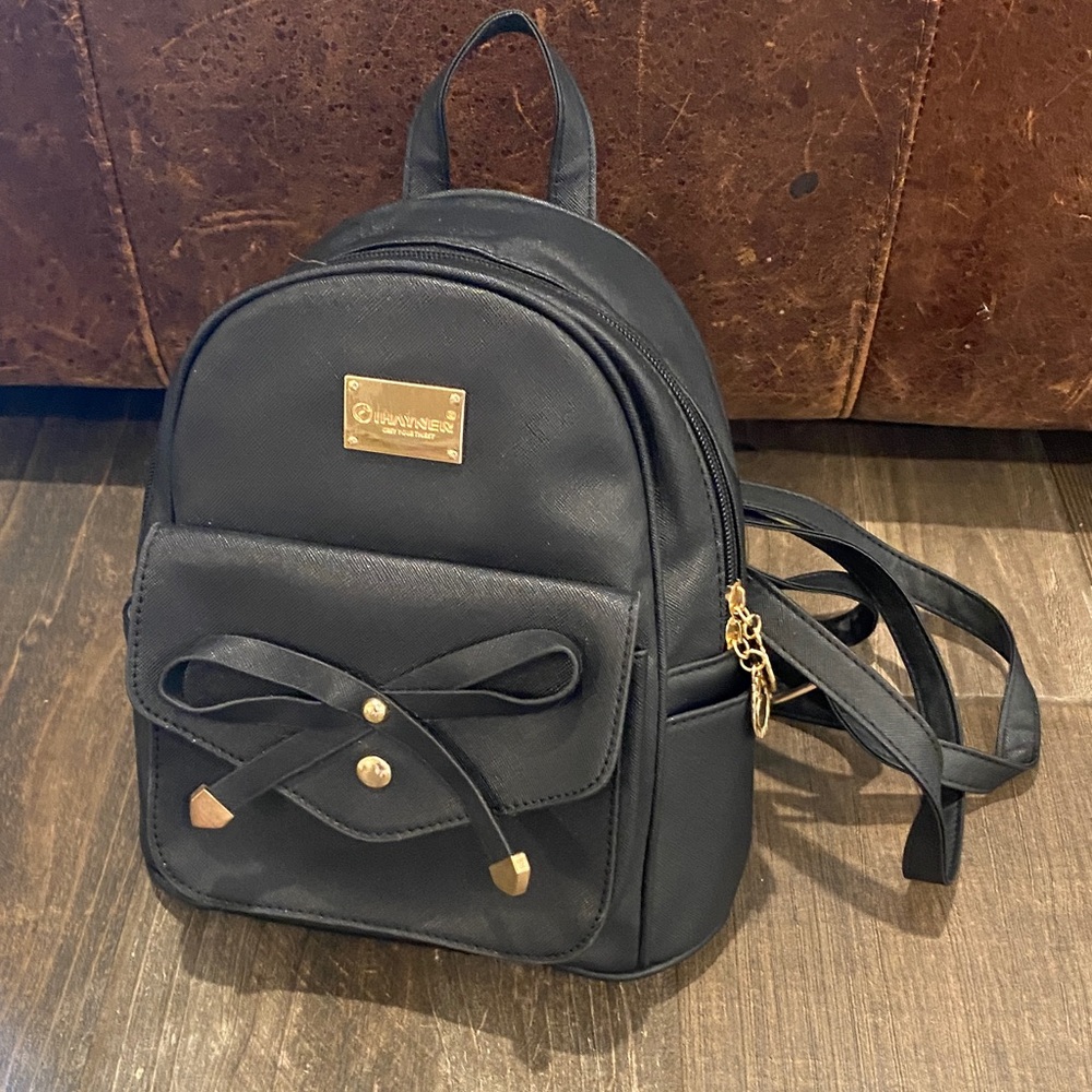 Chic Black Backpack with Gold Details